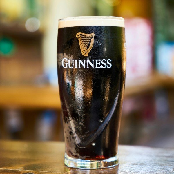 Guinness beer glass on a table